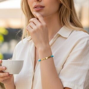 Michael Kors Haute Hardware Gold-tone bracelet with blue